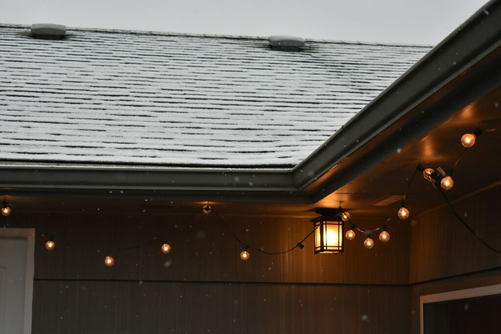 a snow covered roof in kitchener waterloo, this roof is made with proper drainage in mind, preventing ice dams and the need to use harmful roof melt which can damage your roof